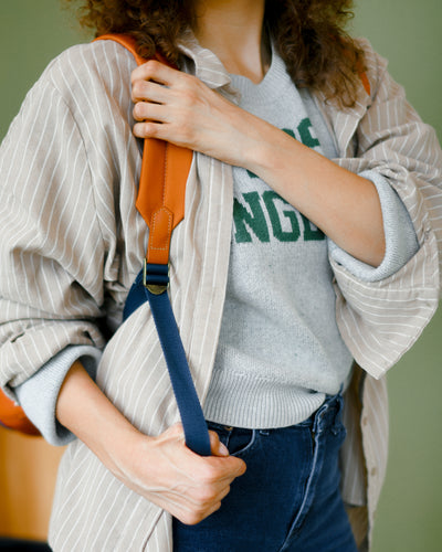 Adjusting backpack strap